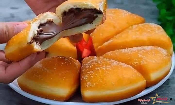 دوناتس المثلثات بالنوتيلا ... مقدم من: مطبخ عالم النجوم 2 دوناتس المثلثات بالنوتيلا ... مقدم من: مطبخ عالم النجوم