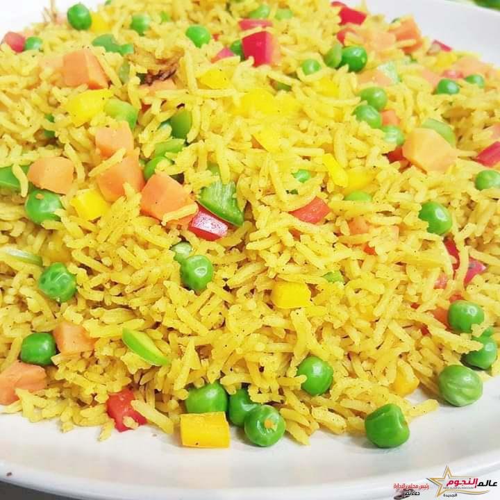 طريقة تحضير أرز بالخضروات من مطبخ عالم النجوم 2 طريقة تحضير أرز بالخضروات من مطبخ عالم النجوم