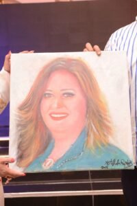 مصطفى راغب يخلّد بريشته مسيرة دعاء نصر في خدمة المجتمع